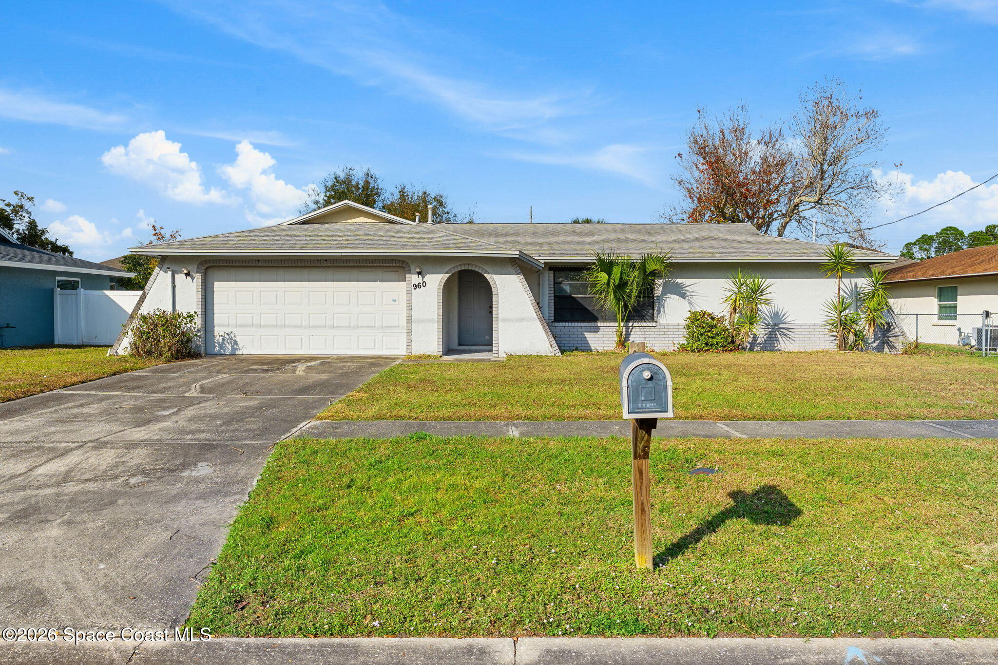 960 Pineland Drive Rockledge, FL 32955 - Photo 25 of 32 a front view of a house with garden