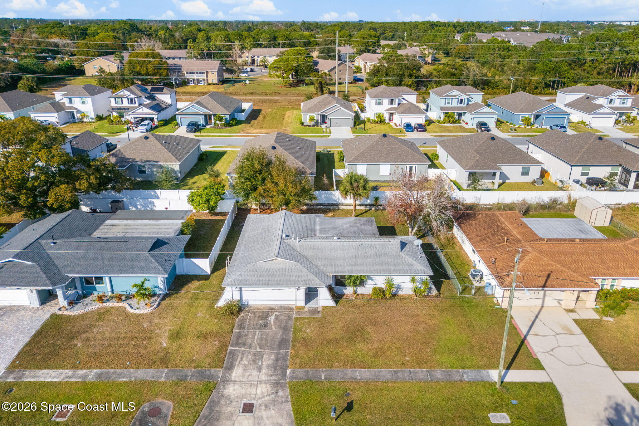 960 Pineland Drive Rockledge, FL 32955 - Photo 27 of 32 an aerial view of residential houses with outdoor space