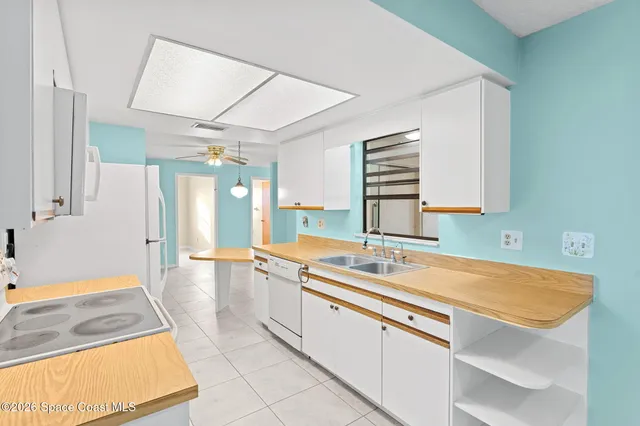 a spacious bathroom with a sink a mirror and a bathtub