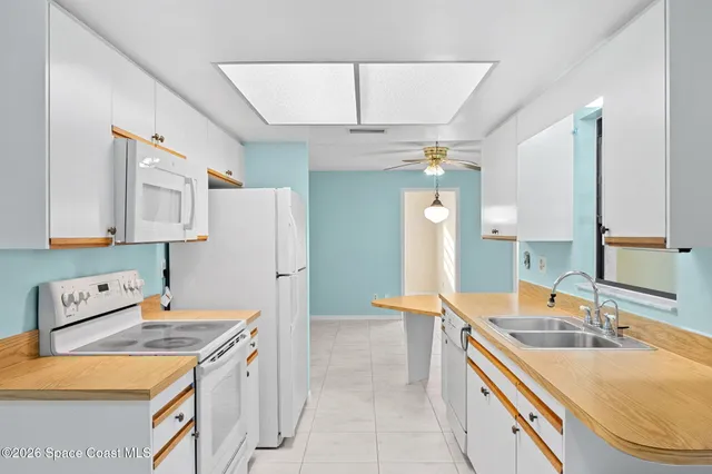 a bathroom with a sink double vanity and a mirror