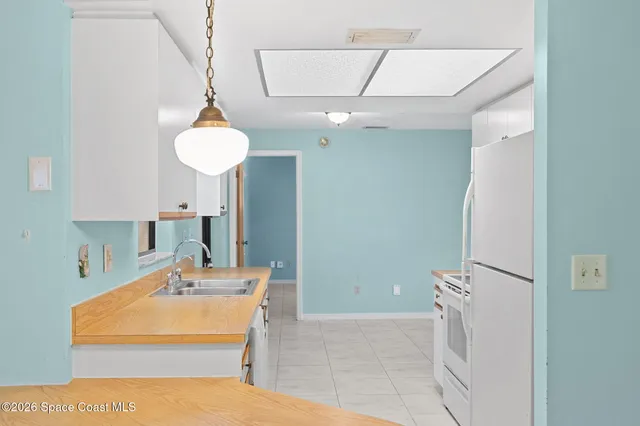 a bathroom with a sink a mirror and shower