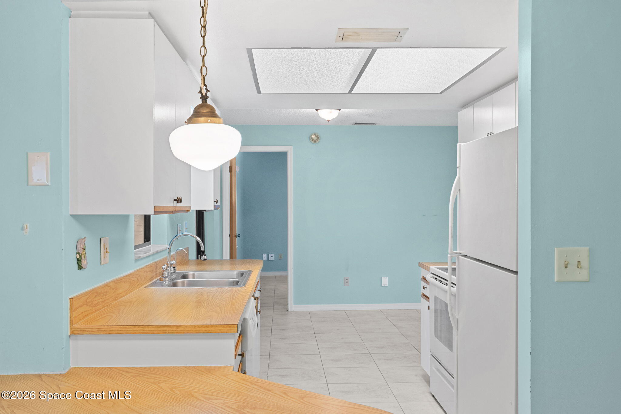 960 Pineland Drive Rockledge, FL 32955 - Photo 7 of 32 a bathroom with a sink a mirror and shower