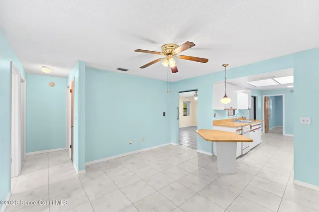 a dining room with a table and chairs