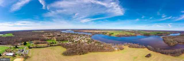 a view of a swimming pool in front of the house