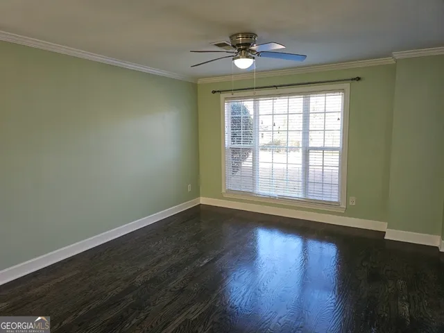 a utility room with washing machine and window