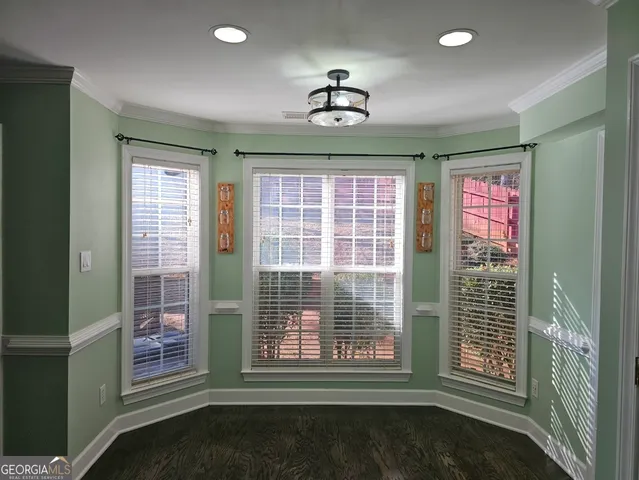a bathroom with a granite countertop sink a toilet and bathtub