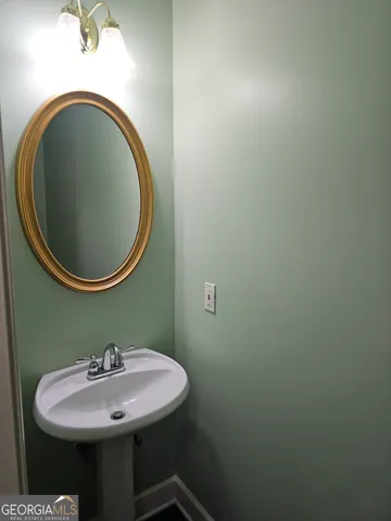an empty room with a bathroom