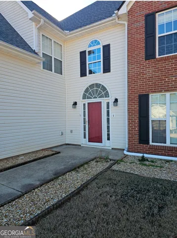 a view of room with window and ceiling fan