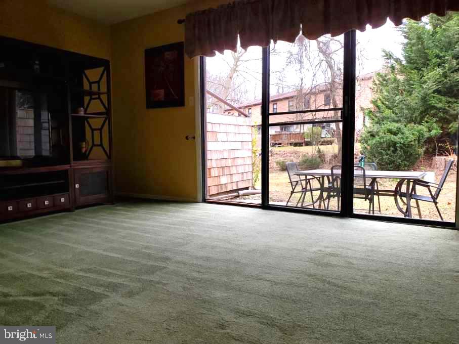 83 Bishop Drive Aston, PA 19014 - Photo 19 of 47 Living Room with Sliding Doors to Rear Patio