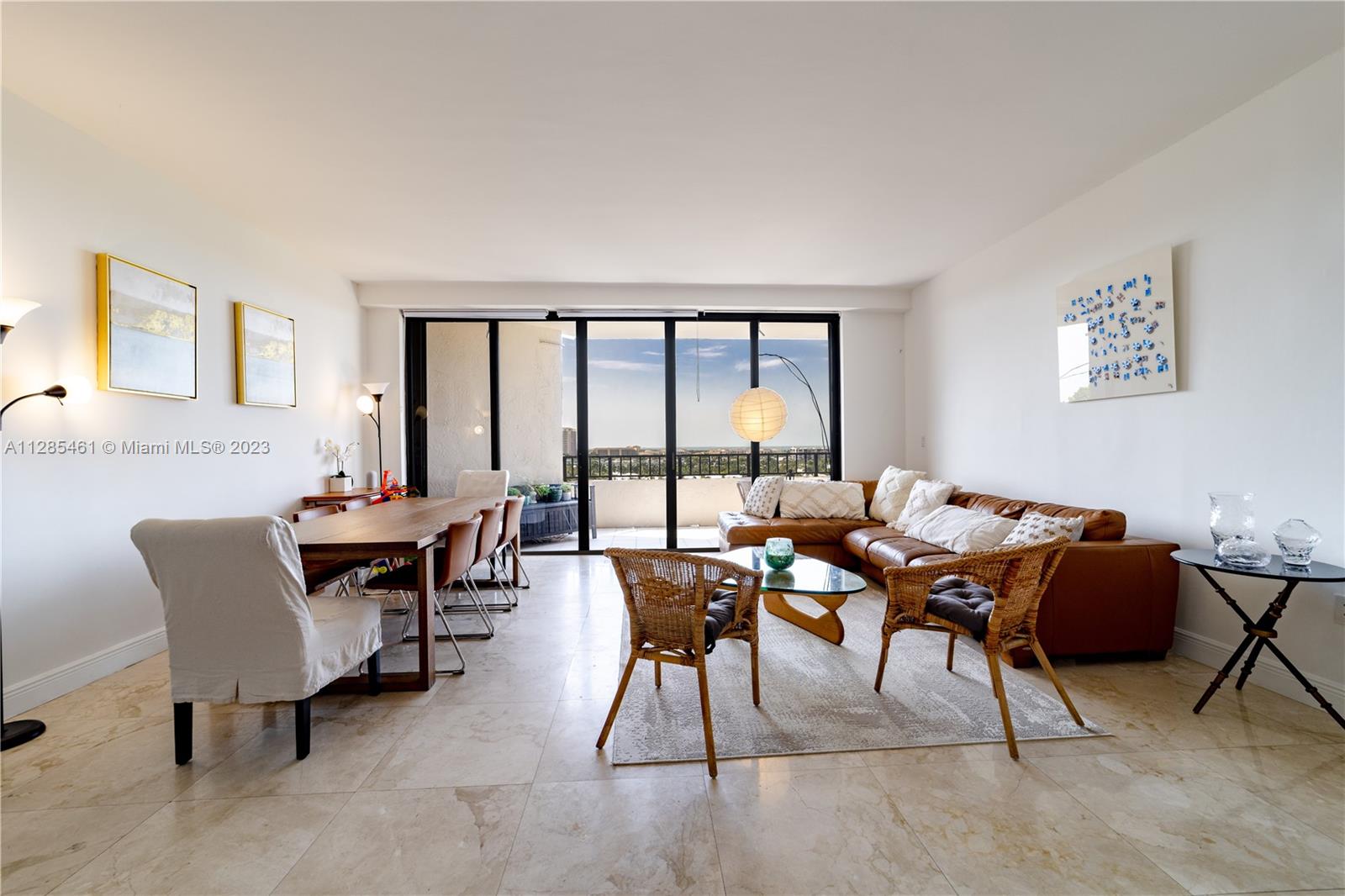 151 Crandon Boulevard, Unit 1023 Key Biscayne, FL 33149 - Photo 22 of 55 a view of a dining room with furniture and a potted plant