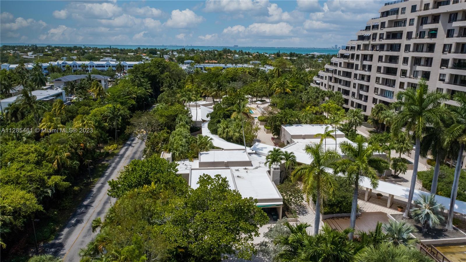 151 Crandon Boulevard, Unit 1023 Key Biscayne, FL 33149 - Photo 6 of 55 an aerial view of a residential houses with outdoor space and trees