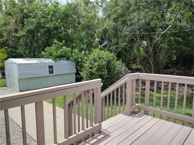 a balcony with yard in back