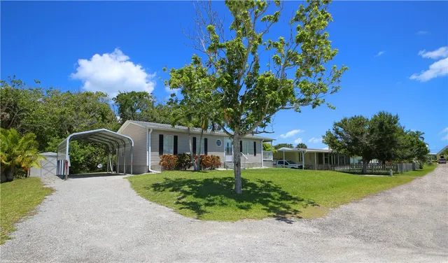 a view of outdoor space with garden and trees