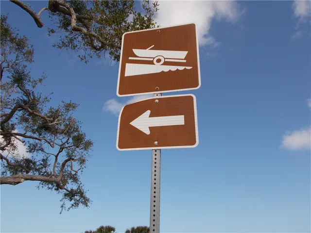 a view of swimming pool with outdoor seating and yard in the back