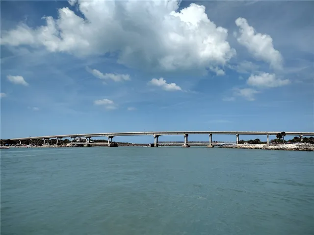 a view of a swimming pool and an outdoor seating