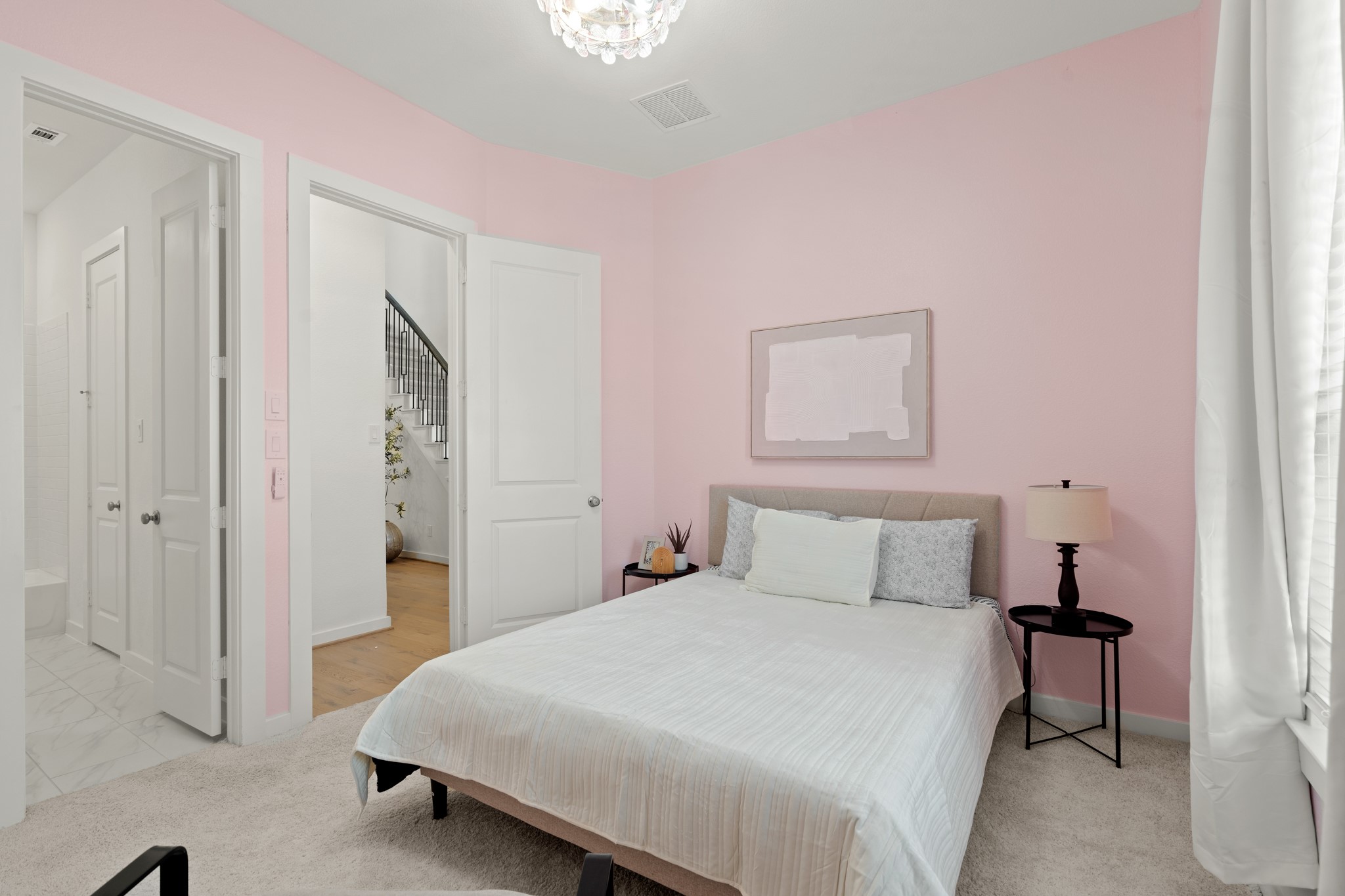 7303 Compass Drive Katy, TX 77493 - Photo 20 of 31 a bedroom with a bed and a table