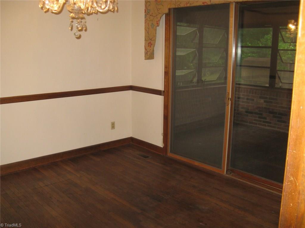 5204 Saddle Brook Road Oak Ridge, NC 27310 - Photo 14 of 29 Dining Room leading out to Sunroom.