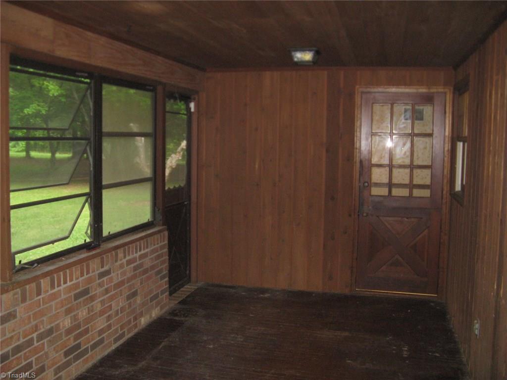 5204 Saddle Brook Road Oak Ridge, NC 27310 - Photo 15 of 29 Sunroom with entry to kitchen breakfast room and dining room.