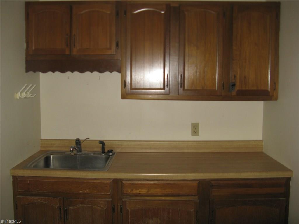 5204 Saddle Brook Road Oak Ridge, NC 27310 - Photo 20 of 29 Laundry Room with Sink & More Cabinets