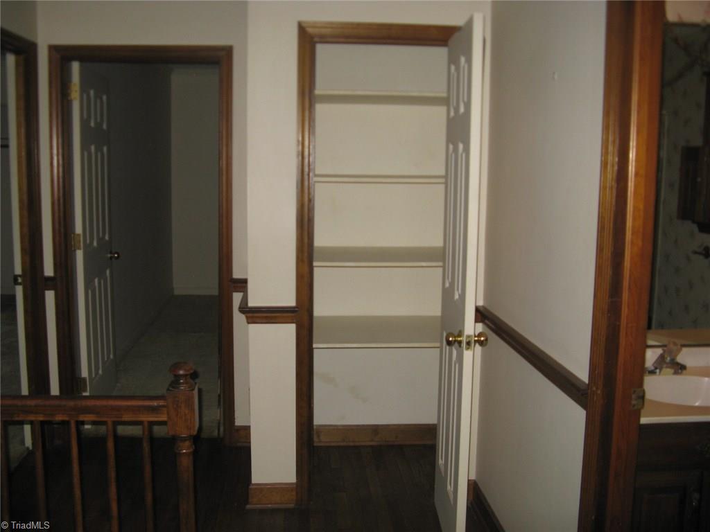 5204 Saddle Brook Road Oak Ridge, NC 27310 - Photo 22 of 29 Wide area around Upstairs with linen closet and guest bath.