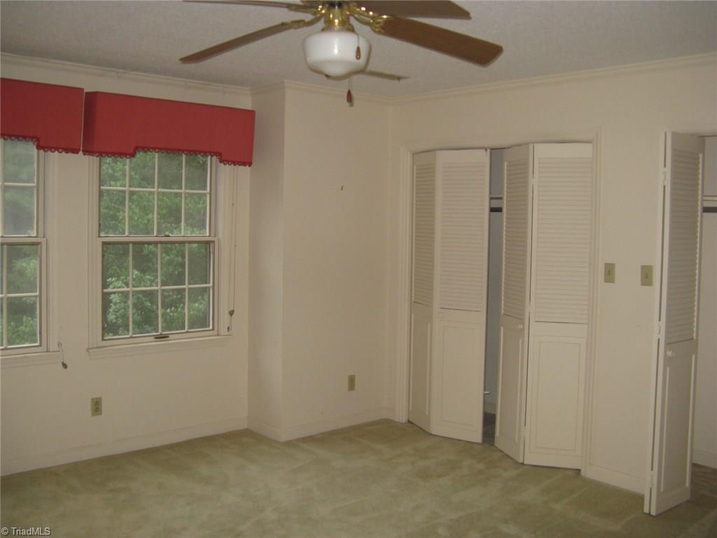 5204 Saddle Brook Road Oak Ridge, NC 27310 - Photo 26 of 29 2nd Bedroom with double closets - very spacious, also has built in desk.