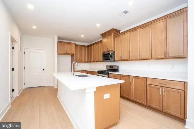 a view of a kitchen with electric appliances