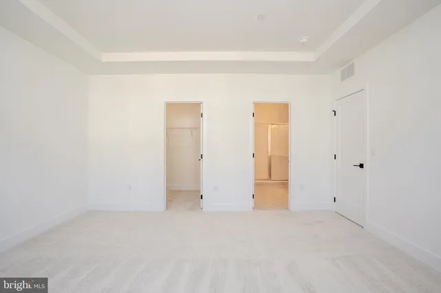 a bathroom with a double vanity sink and mirror