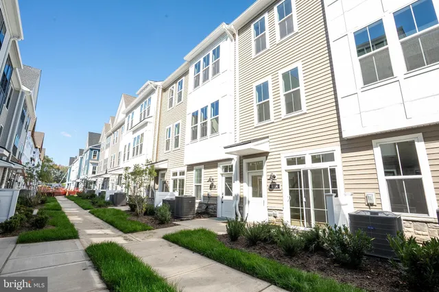 a view of a building with a yard