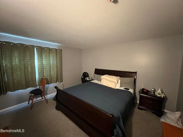 a bed room with a bed and furniture