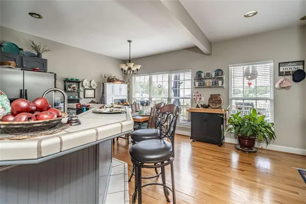a room with stainless steel appliances kitchen island granite countertop furniture and a kitchen view