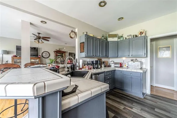 a kitchen with sink and cabinets