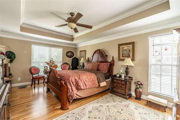 a bed room with a bed and a chandelier