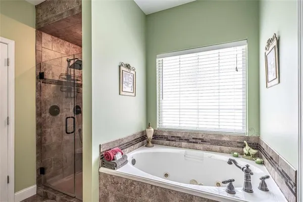 a bath tub sitting next to a window