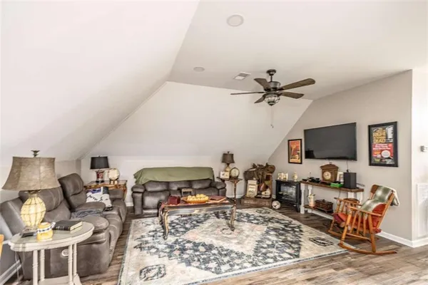 a view of a kitchen with a table and chairs