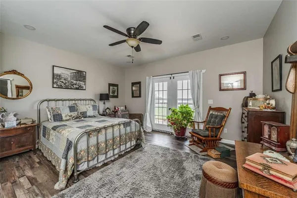 a livingroom with furniture and a potted plant
