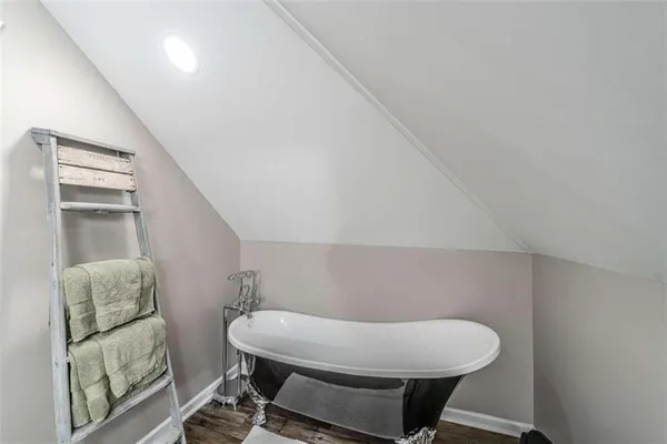 a bed room with two beds and a lamp