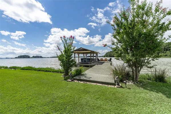 a view of a lake with a big yard