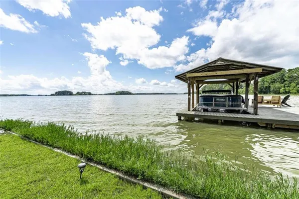 a view of sitting area with furniture and wooden floor