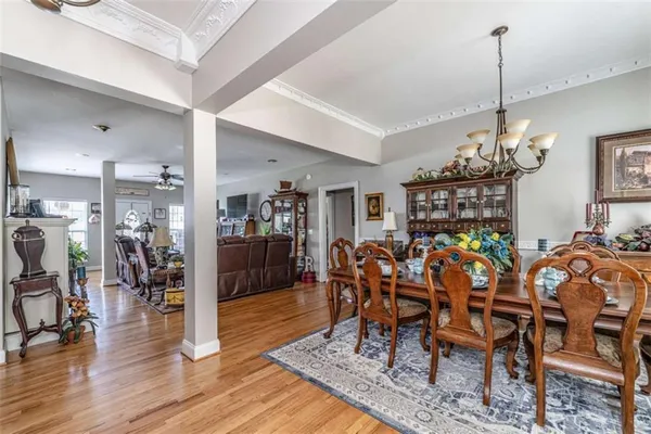 a view of a dining room with furniture and wooden floor