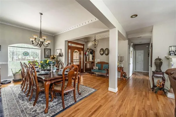 a view of a dining room with furniture window and wooden floor