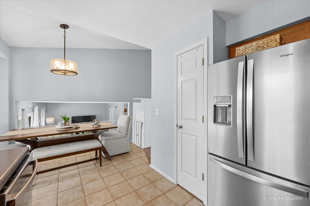 1150 Appleton Lane Geneva, IL 60134 - Photo 20 of 43 a bedroom with a bed and a refrigerator