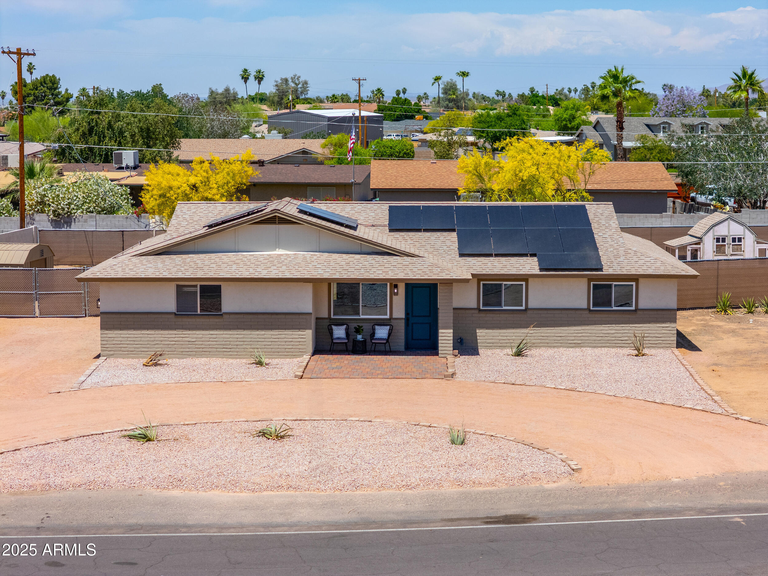 an aerial view of a house with a yard