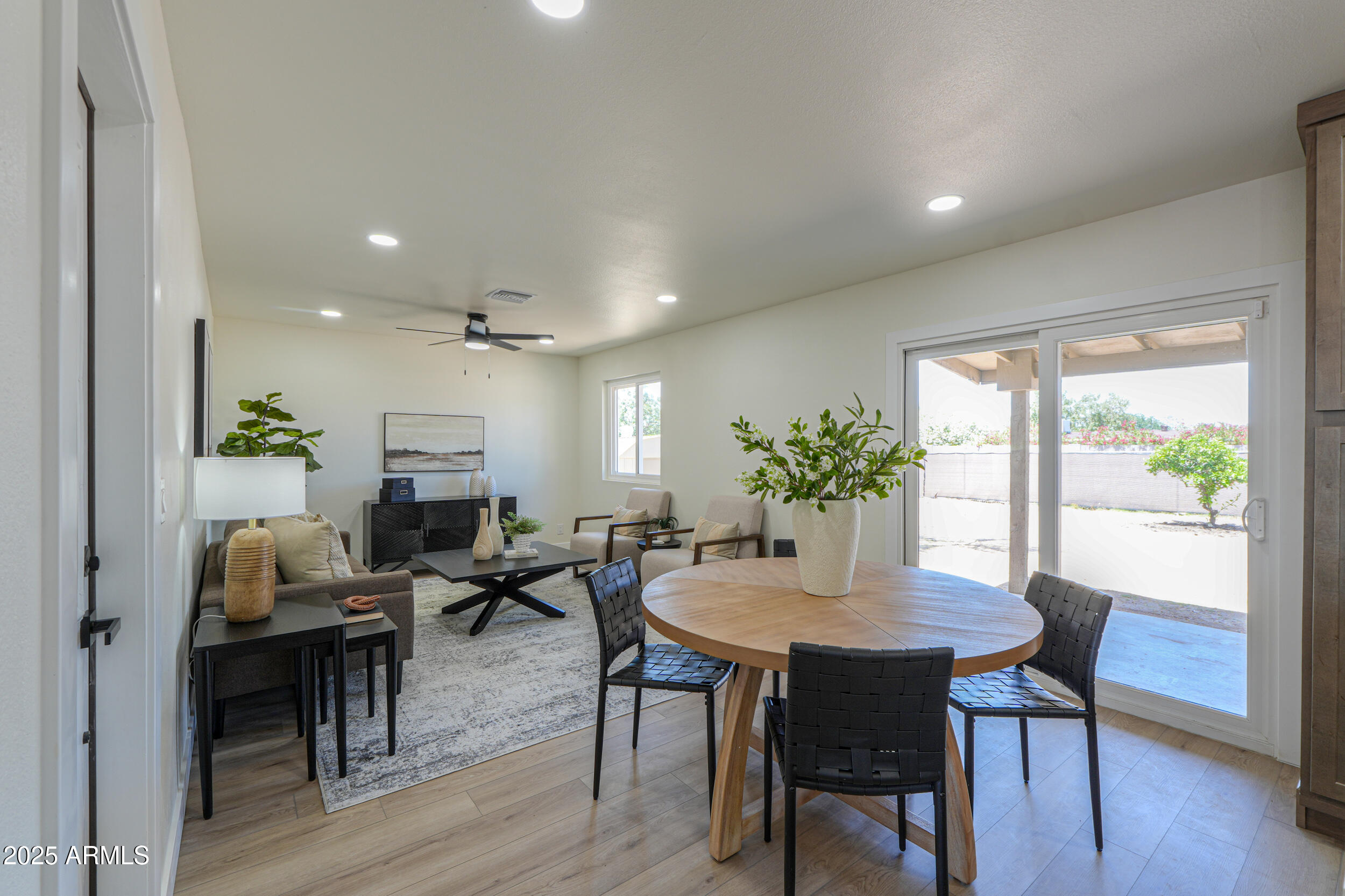 6502 East Rustic Drive Mesa, AZ 85215 - Photo 11 of 40 a view of a dining room with furniture window and wooden floor