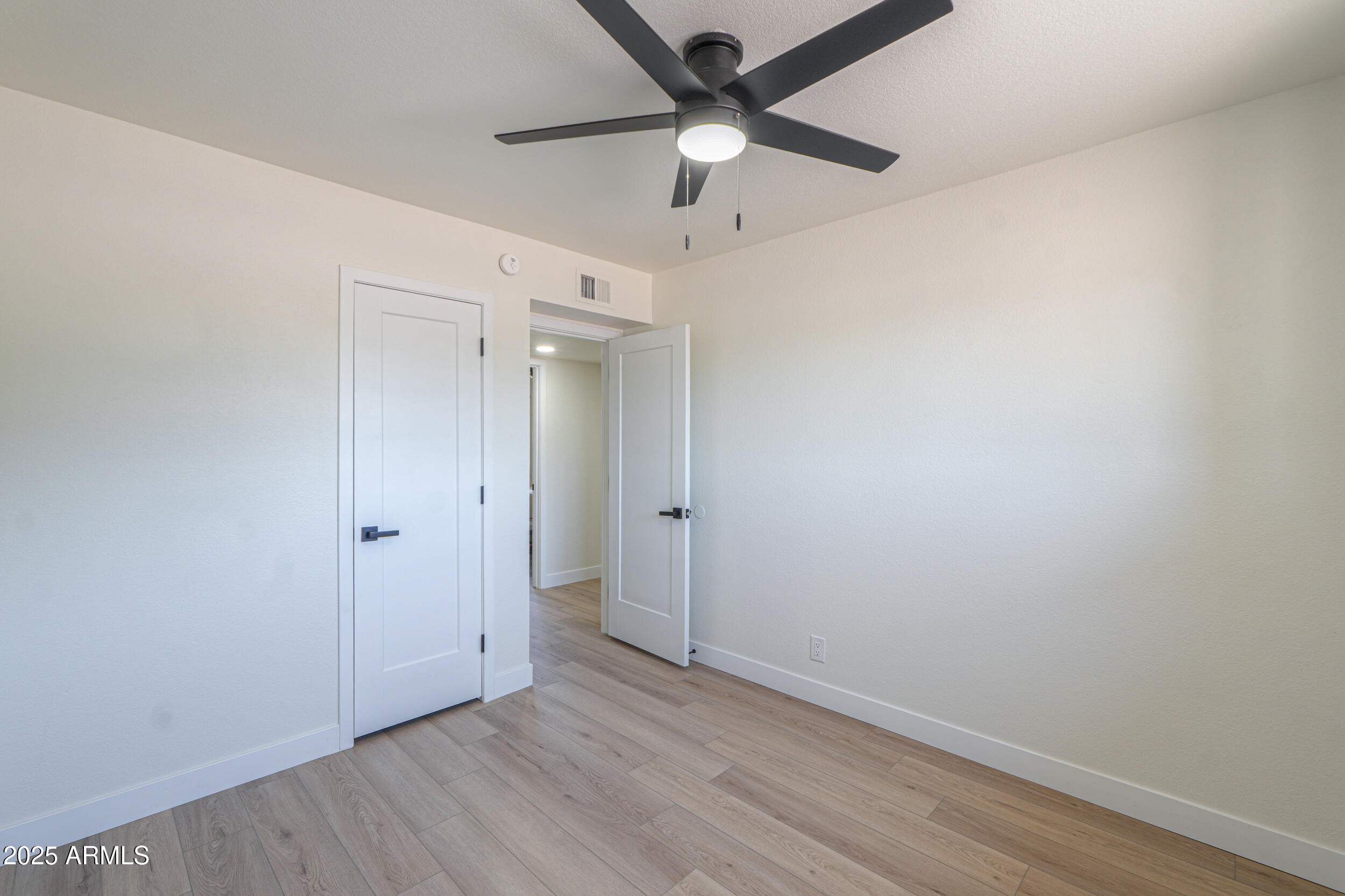 6502 East Rustic Drive Mesa, AZ 85215 - Photo 21 of 40 wooden floor in an empty room
