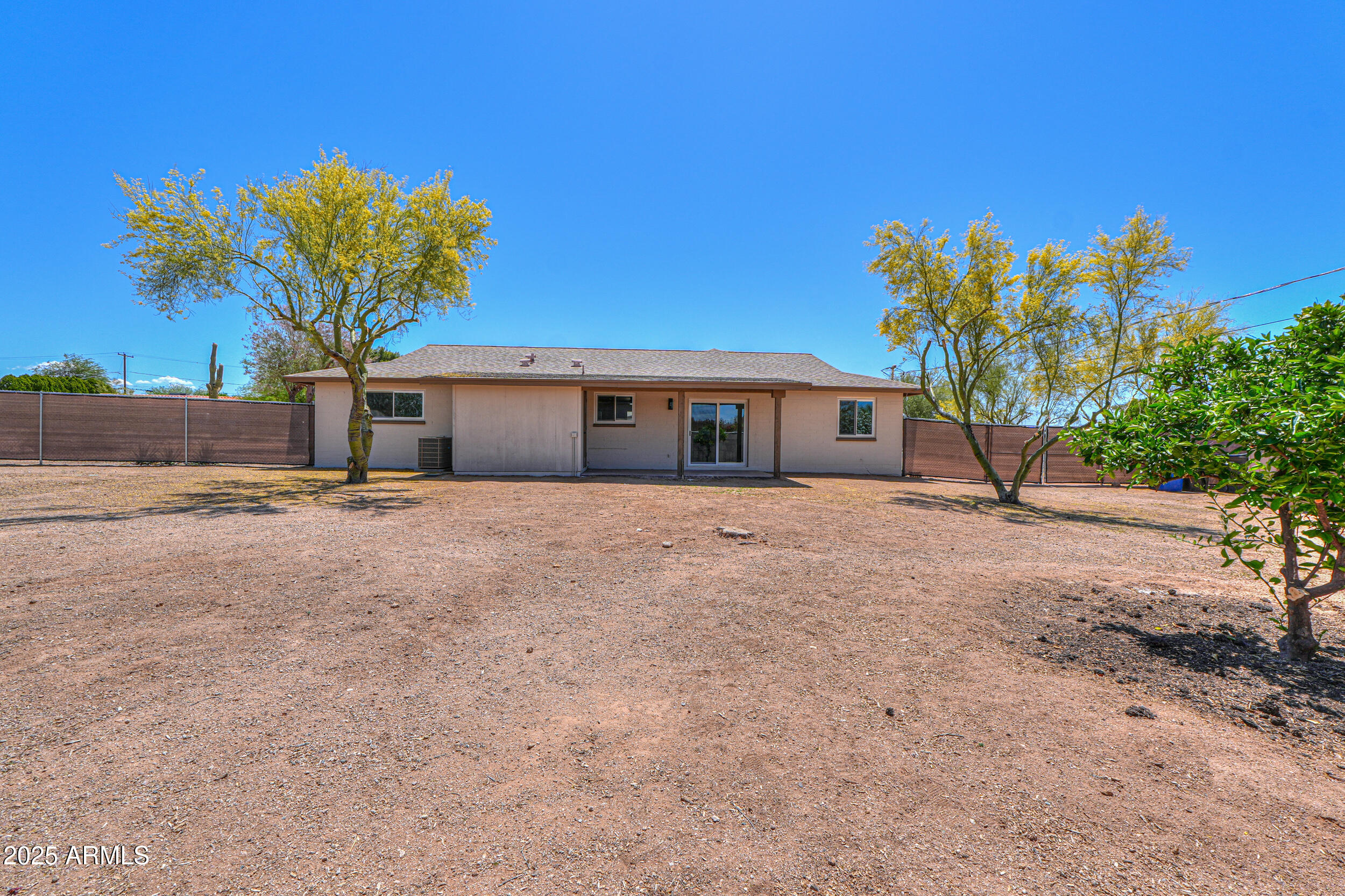 6502 East Rustic Drive Mesa, AZ 85215 - Photo 25 of 40 a front view of a house with a tree