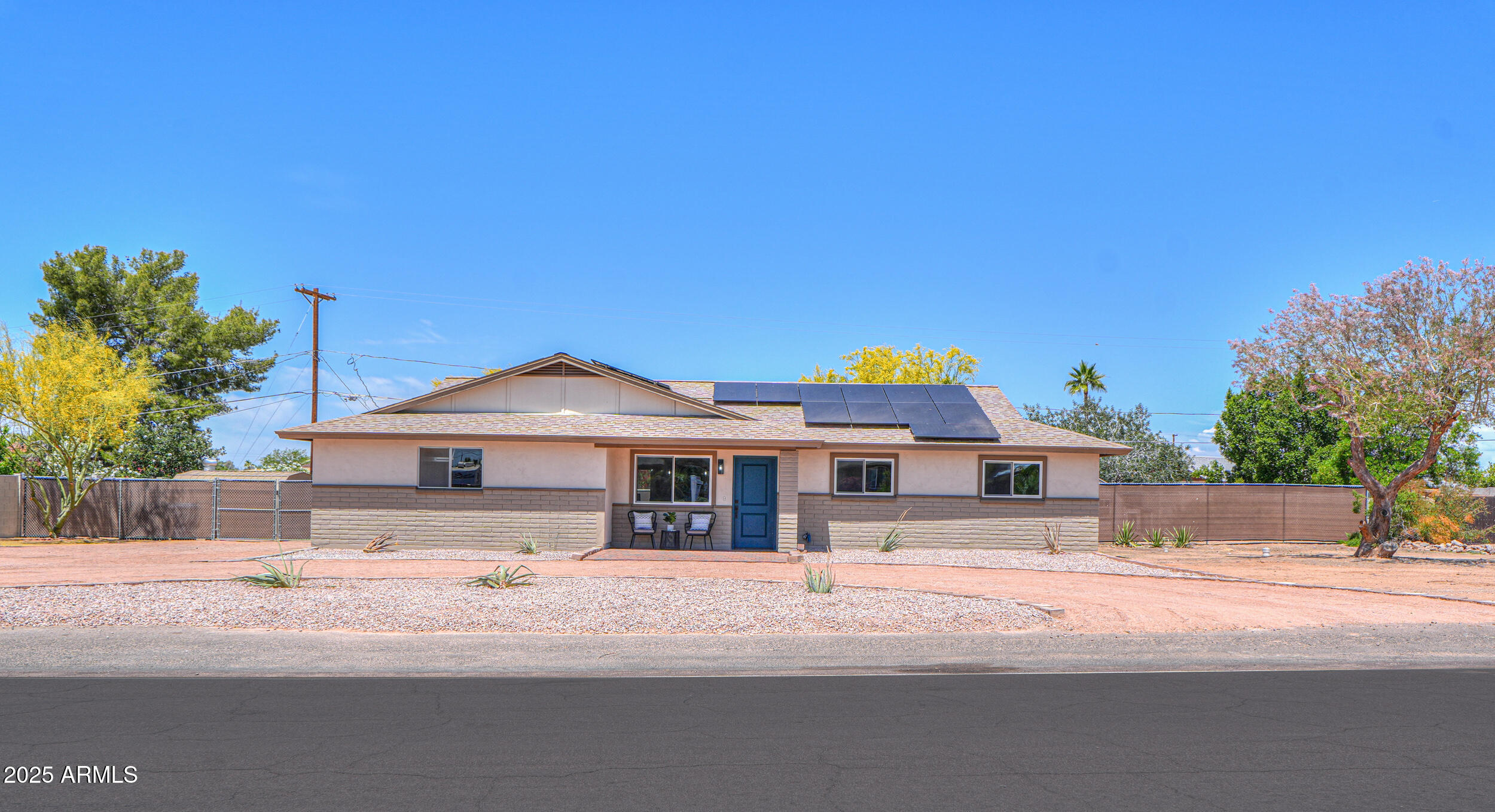 6502 East Rustic Drive Mesa, AZ 85215 - Photo 28 of 40 a front view of a house with a garden and yard