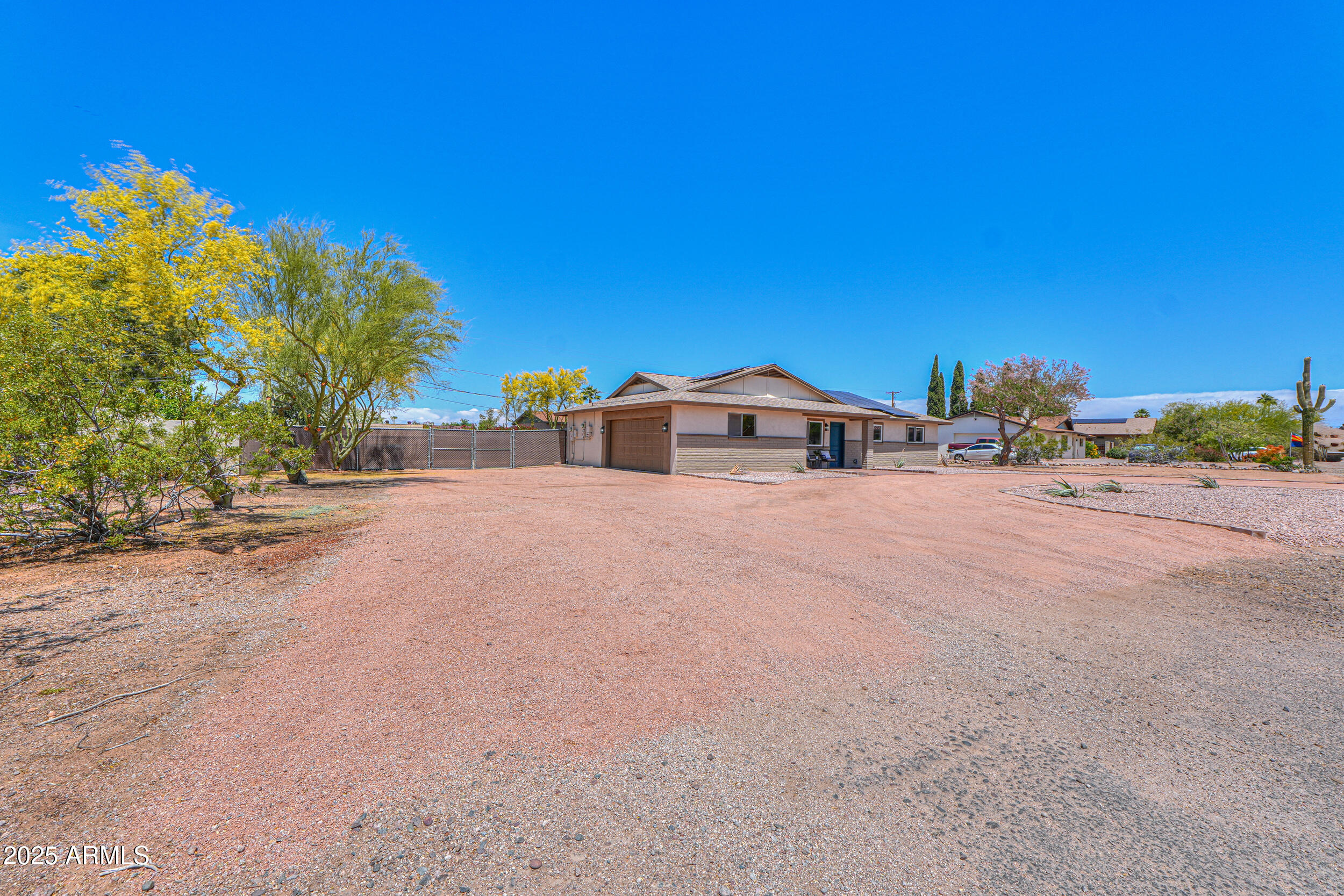 6502 East Rustic Drive Mesa, AZ 85215 - Photo 30 of 40 a view of the house with a street