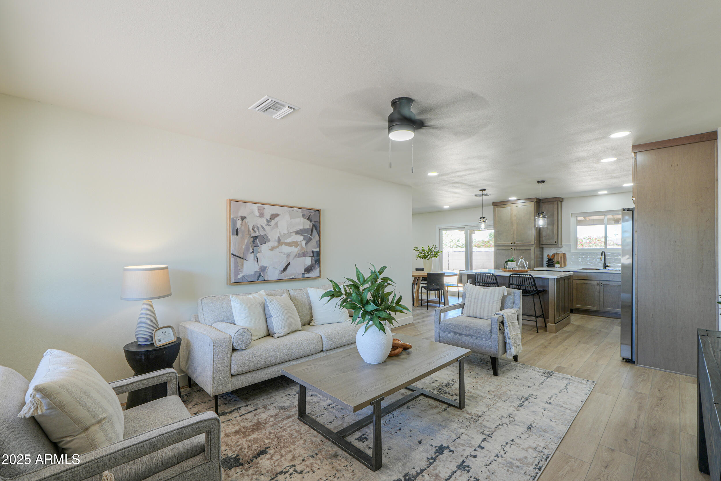 6502 East Rustic Drive Mesa, AZ 85215 - Photo 3 of 40 a living room with furniture and a table