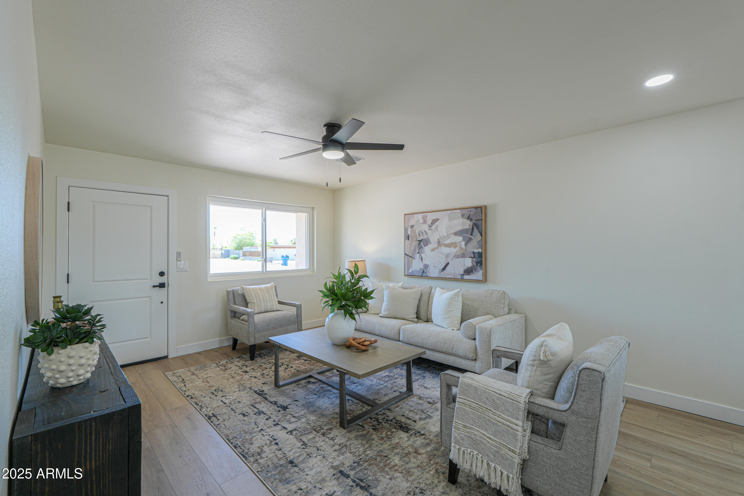 6502 East Rustic Drive Mesa, AZ 85215 - Photo 4 of 40 a living room with furniture and wooden floor