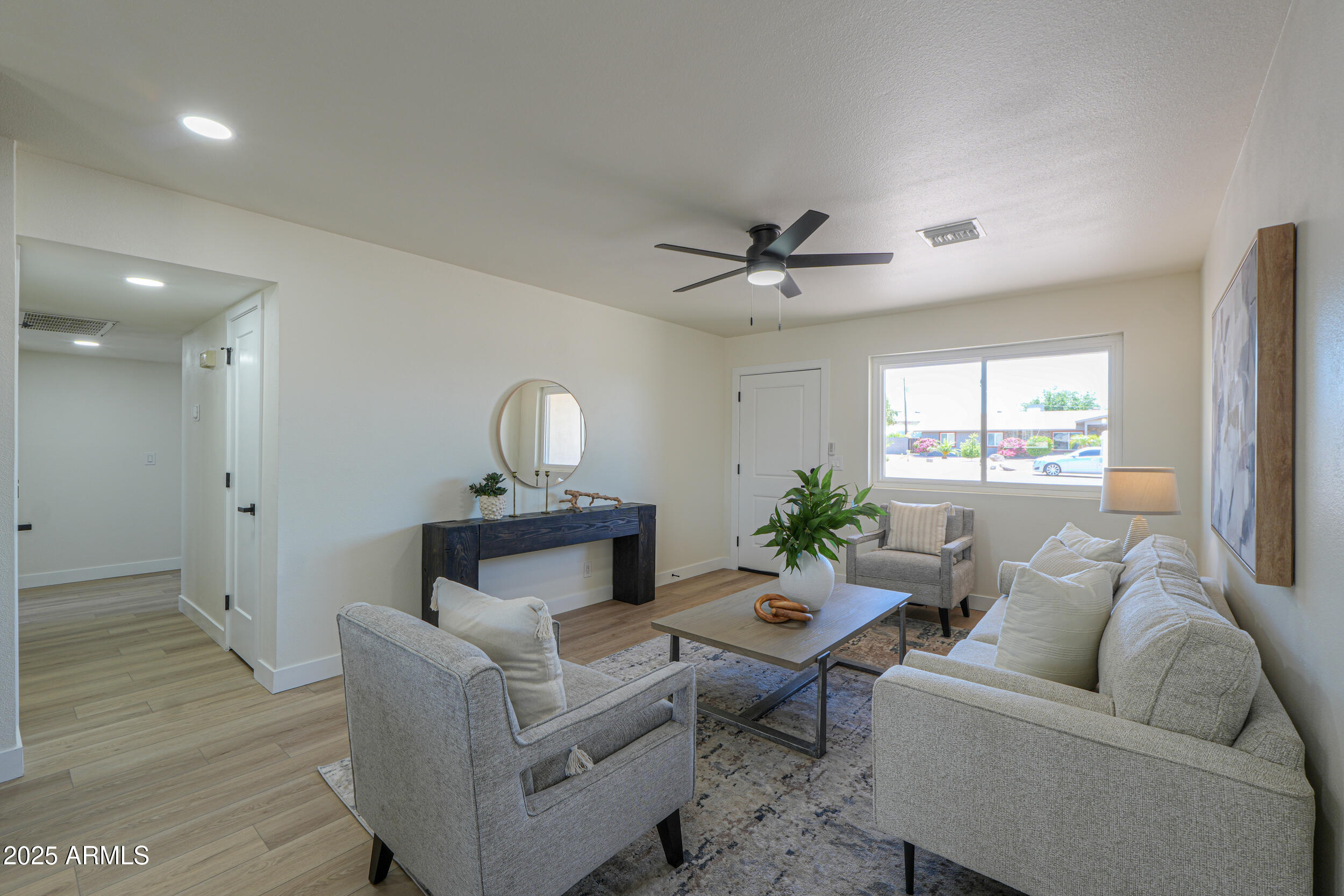 6502 East Rustic Drive Mesa, AZ 85215 - Photo 5 of 40 a living room with furniture and window